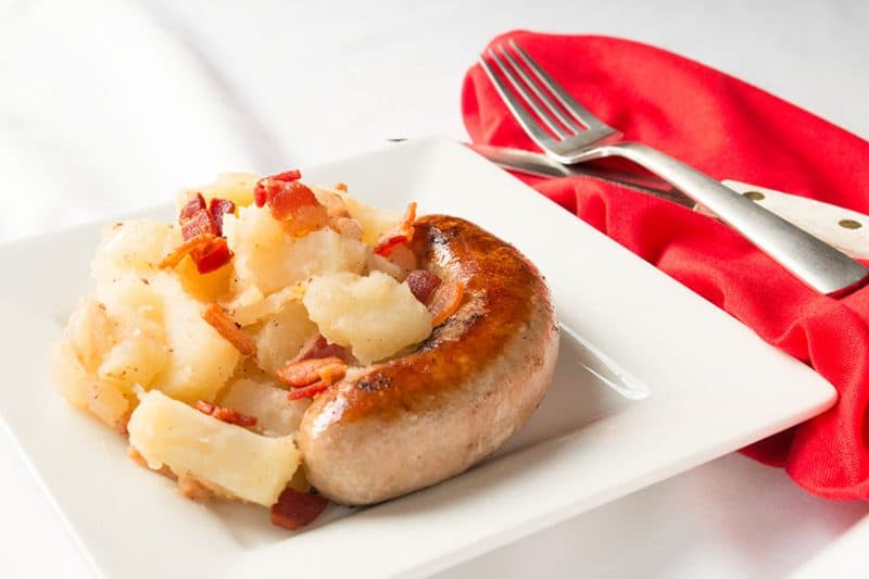 Bratwurst and German Potato Salad on white plate