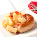 Bratwurst and German Potato Salad on white plate