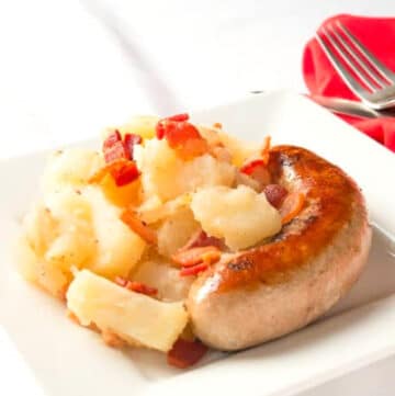 Bratwurst and German Potato Salad on white plate
