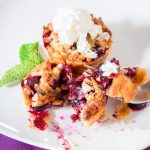 Cute Mini Blueberry Pie with whipped cream on white plate