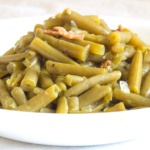 Green beans with bacon and onions in a bowl