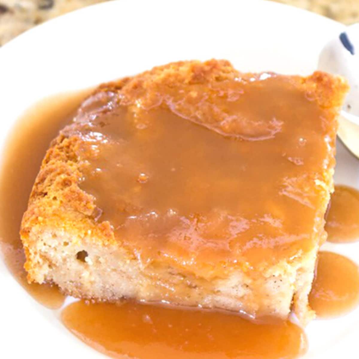 Bread pudding square covered in caramel sauce