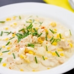 Close-up Chicken Corn Showder with chives in white bowl