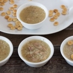 Turkey Rice Soup with oyster crackers in white bowls
