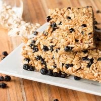 Meal Prep Granola Bars with Blueberries on white plate