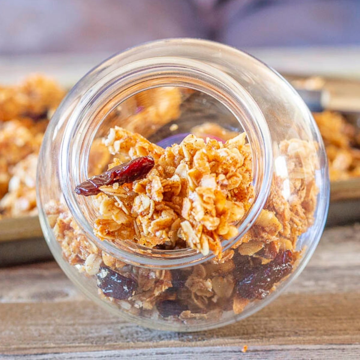 Granola with dried cherries in a glass container