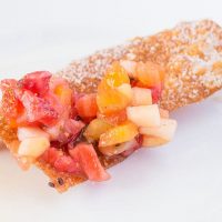 Upclose fruit salsa on fried won ton chip