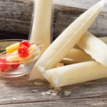 Pina Colada Spiked Popsicle with cherries and pienapple