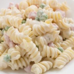 Rotini pasta in ranch flavored dressing with peas and ham