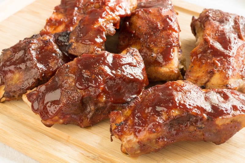 Slow cooker BBQ ribs on a cutting board