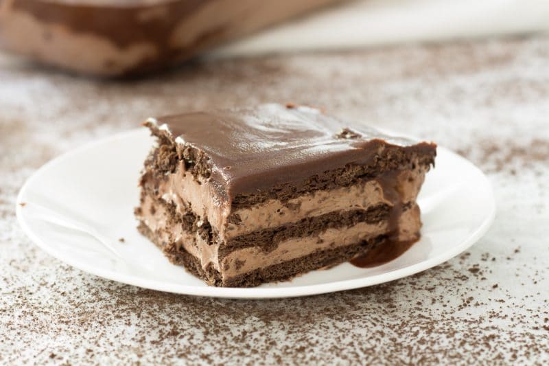 No bake eclair cake made with chocolate graham crackers and chocolate pudding
