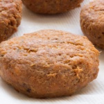 Fried salmon cakes draining on paper towels