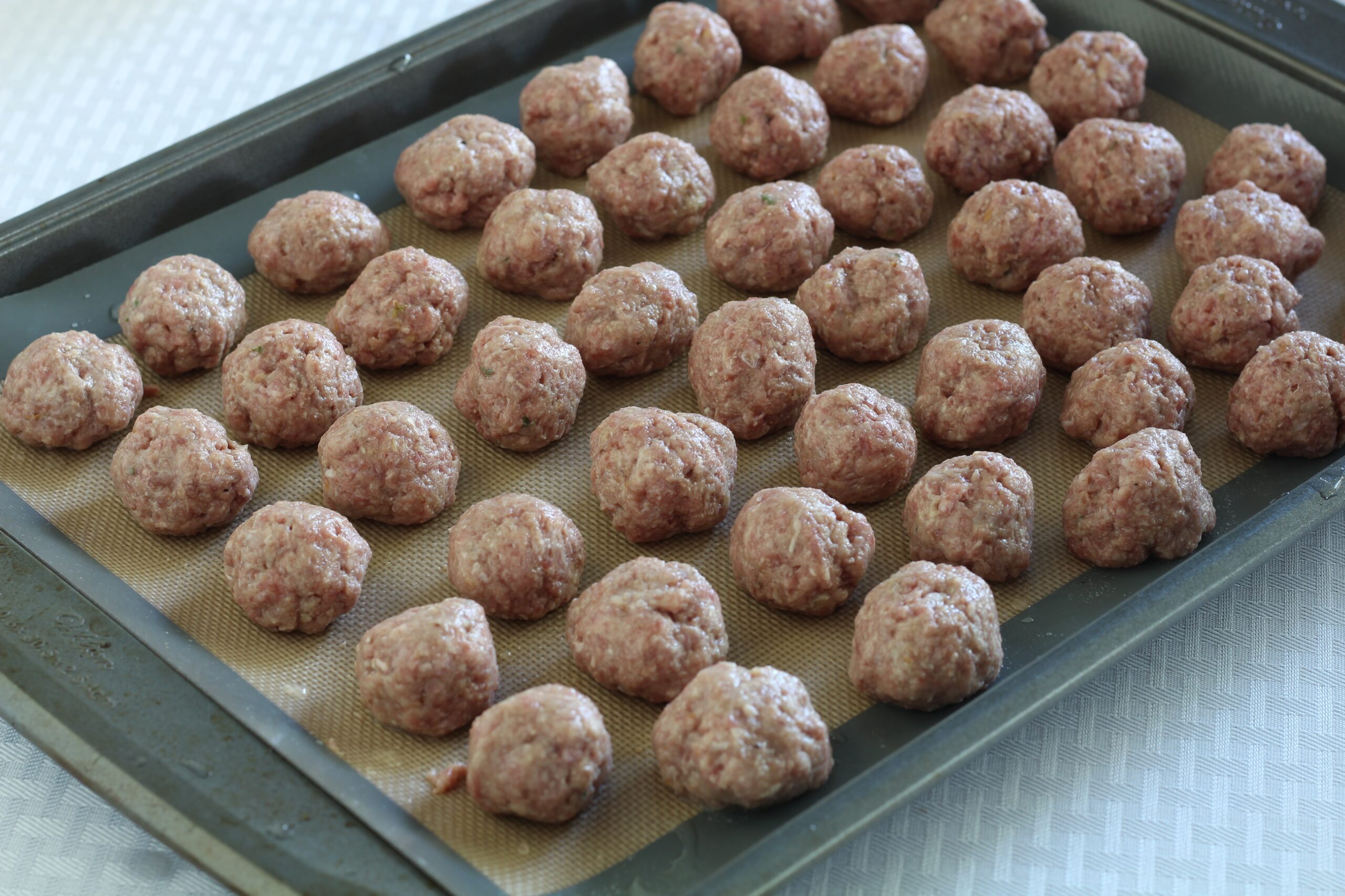 Formed raw meatballs