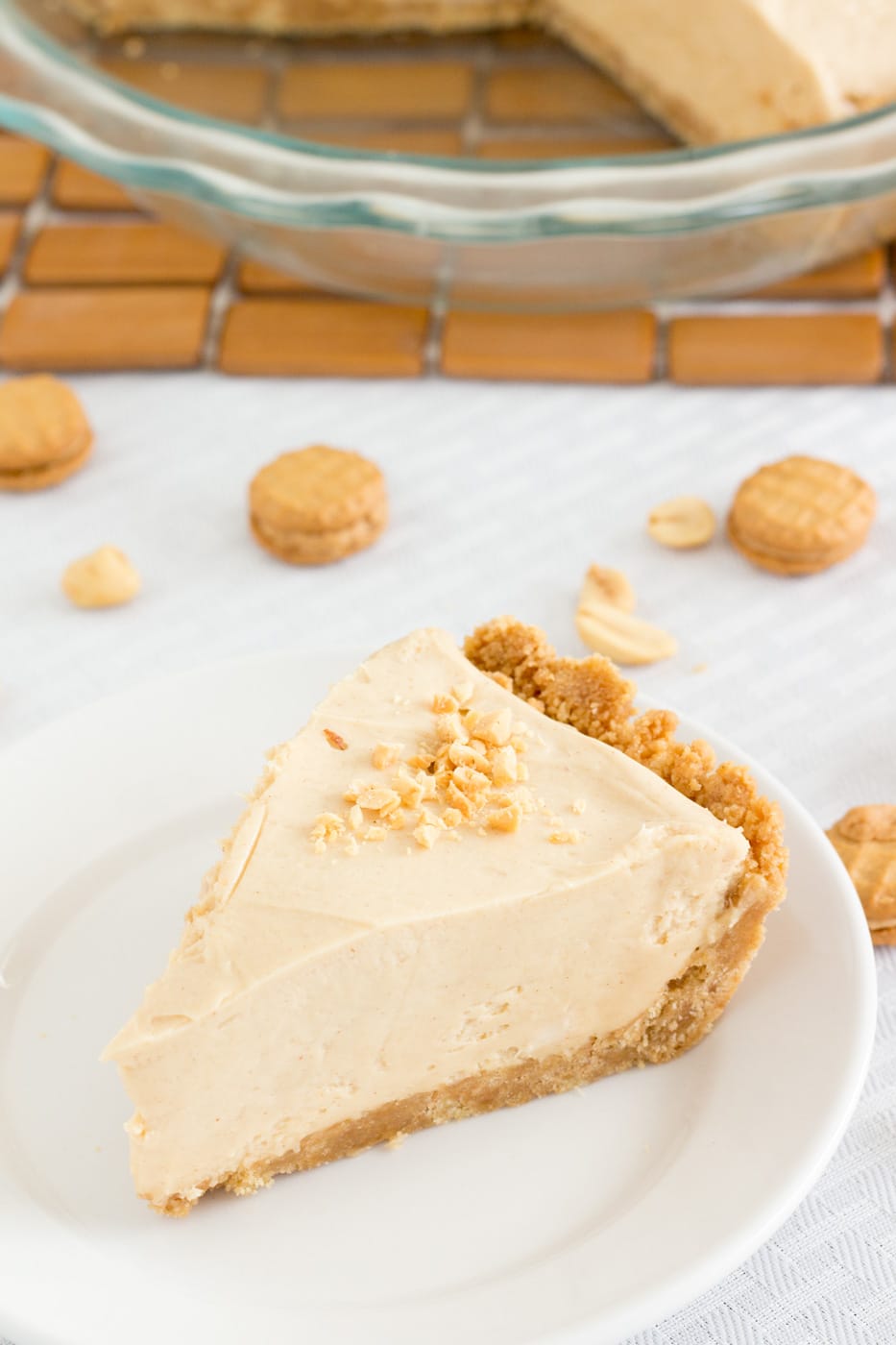 Peanut butter pie slice topping with crushed peanuts