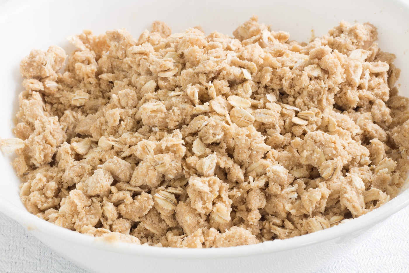Peach crumb bar crumb topping in a bowl