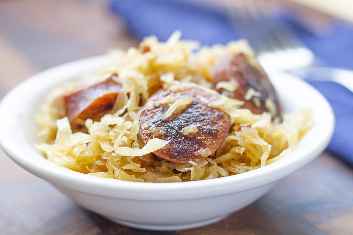 Sauerkraut with sausage slices in a bowl