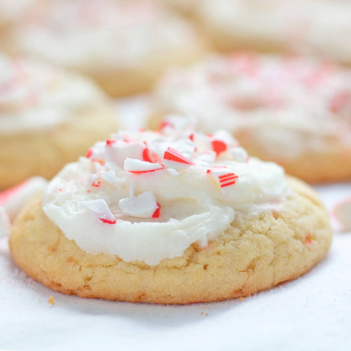 peppermint sugar cookie topped with mint buttercream and crushed candy canes