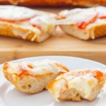 Slices of French bread topped with tomatoes and cheese on a plate