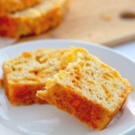 Slice of quick bread with cheese on a plate