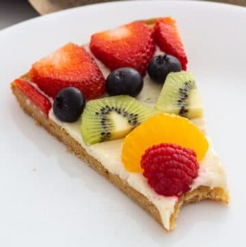 Slice of fruit pizza on a plate