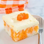 Dreamsicle Cake topped with a candy orange slice