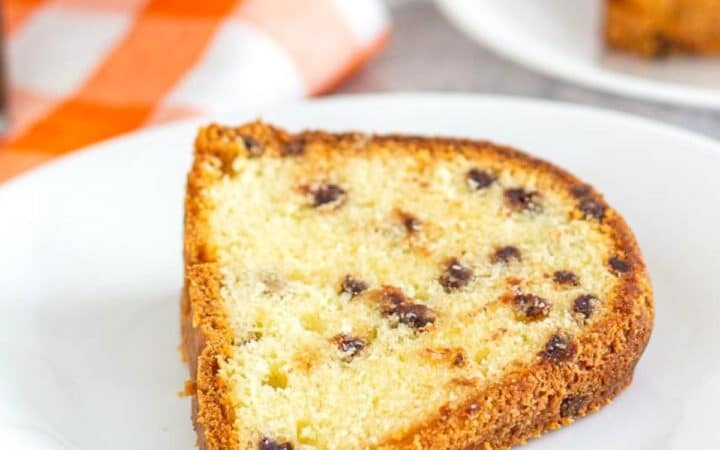 Chocolate Chip Pound Cake slice on a plate with an orange napkin