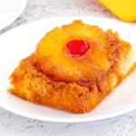 Slice of pineapple upside down cake on a plate