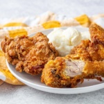 Mustard Fried Chicken with mashed potatoes on a plate