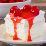Cake slice covered with cherry pie filling