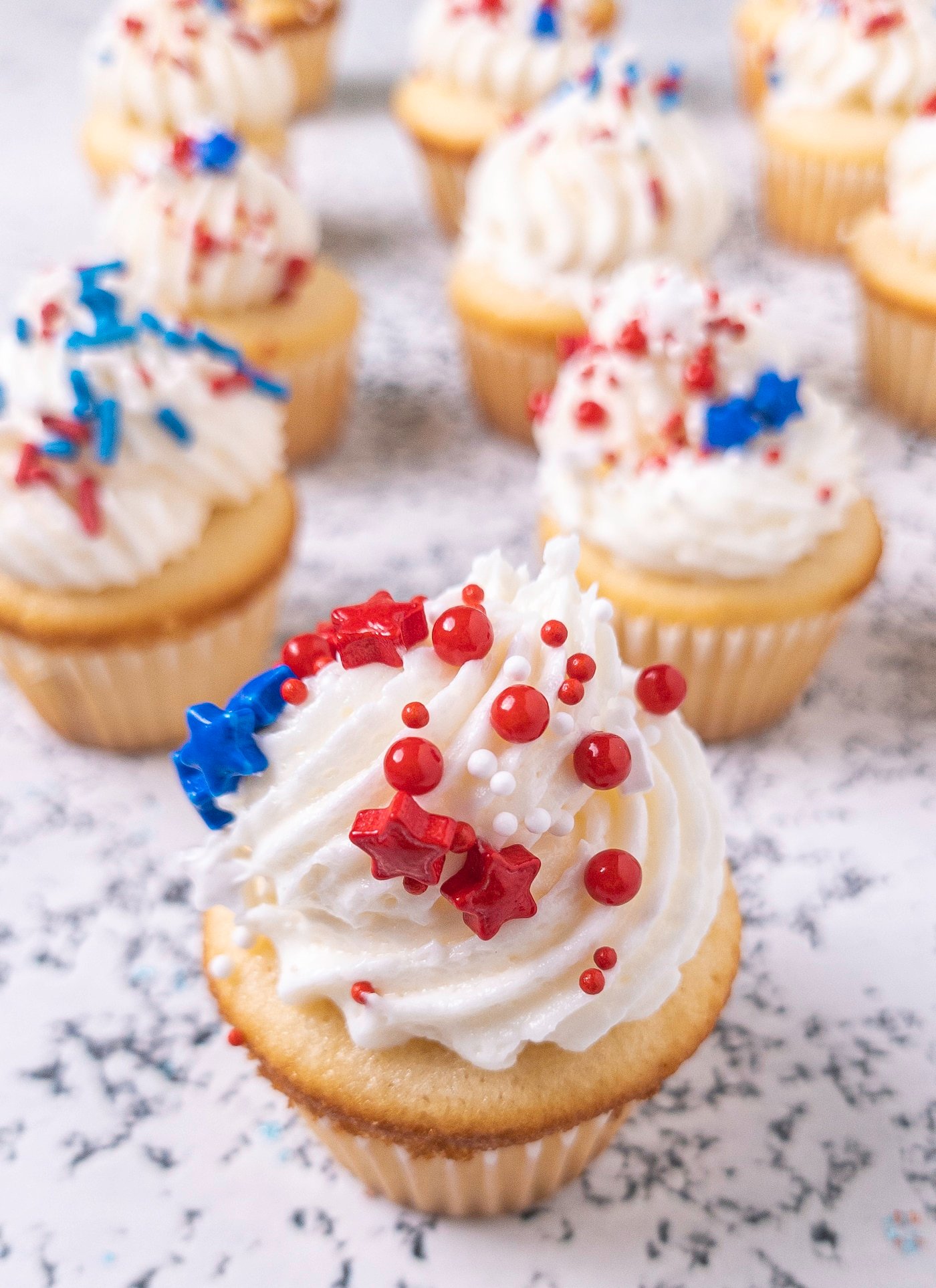 Cupcakes topped with red white and blue sprinkles