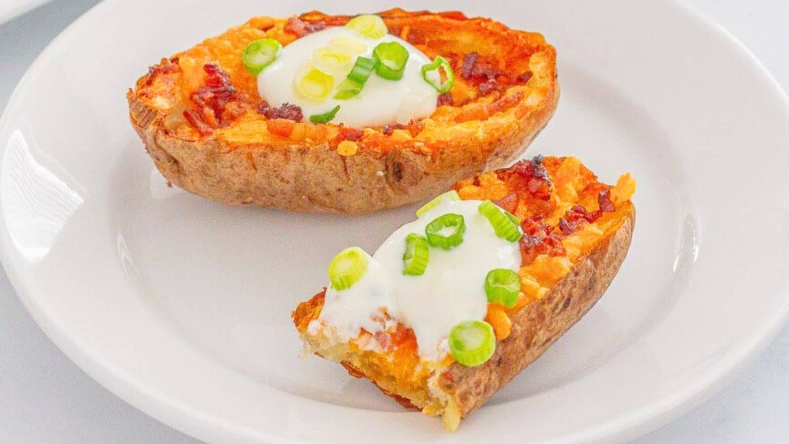 Potato skins topped with sour cream and green onions