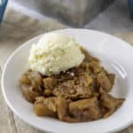 apple crumble on a plate with ice cream