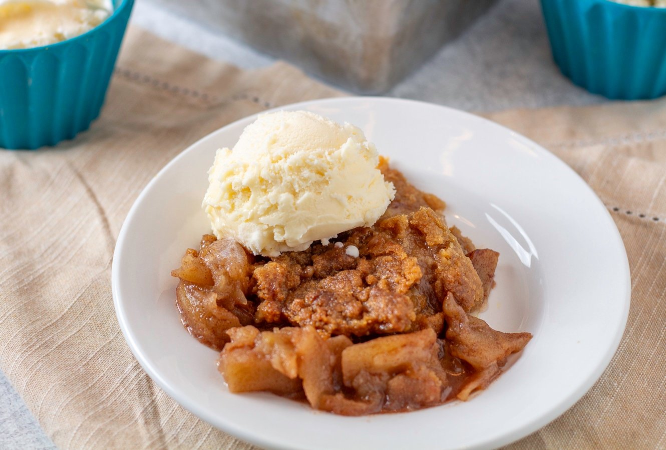 apple crumble on a plate with ice cream