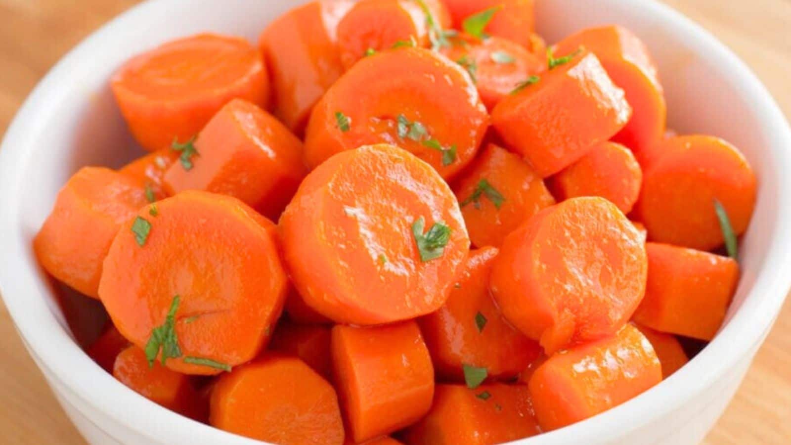 Carrot coins in a bowl sprinkled with parsley
