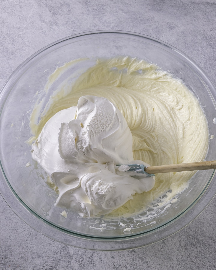 cream cheese filling in a bowl with whipped topping