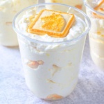 Banana Pudding topped with a shortbread cookie in a disposable dessert cup
