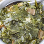 collards with onions and salt pork in a bowl