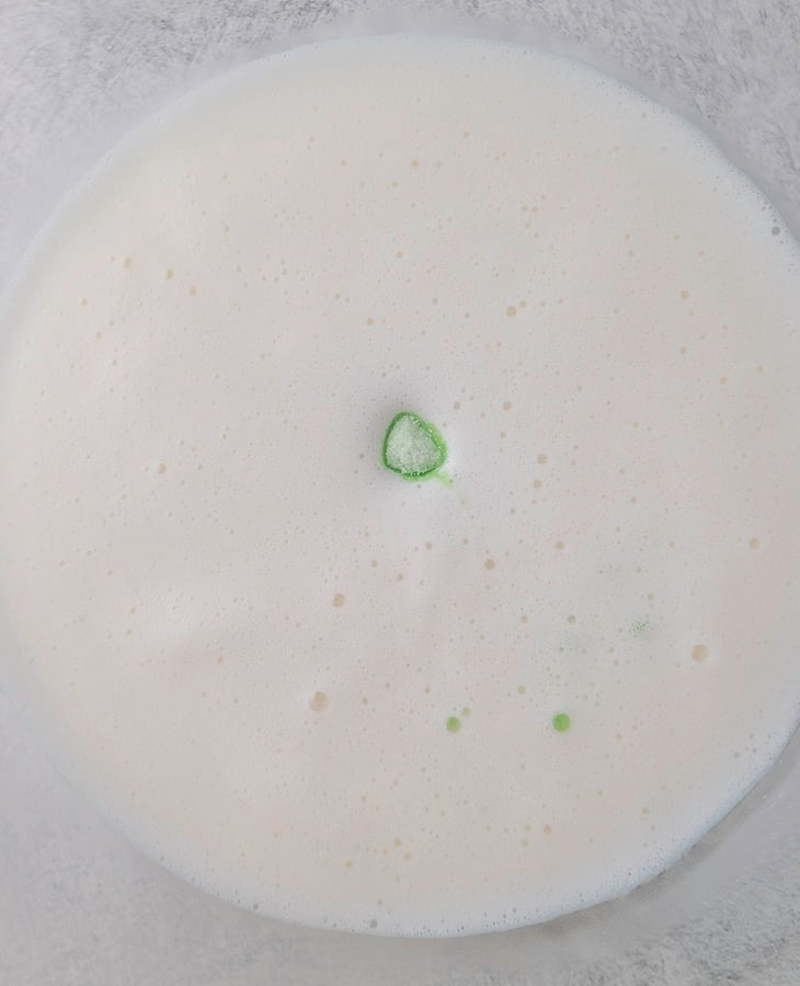 melted marshmallows and milk mixture poured over lime jello