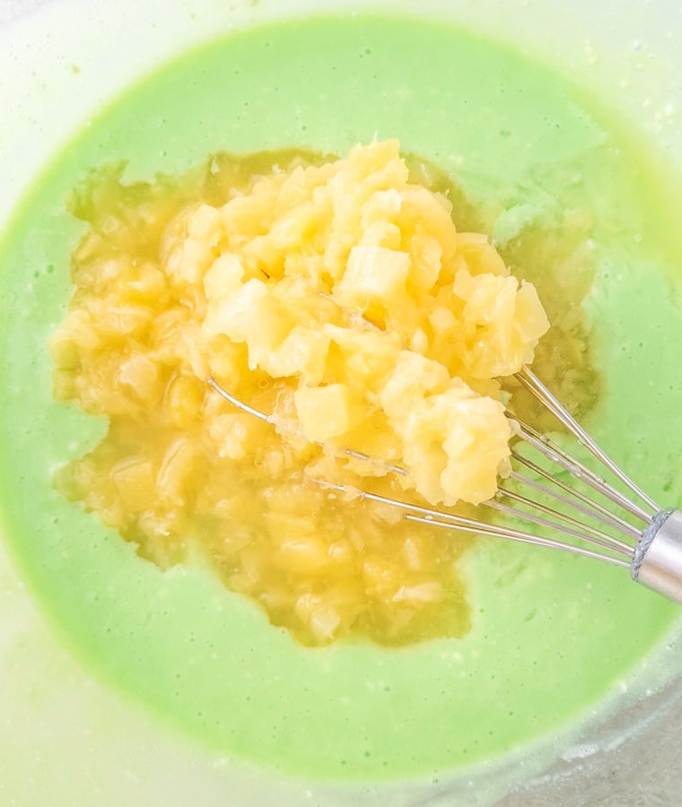 adding crushed pineapple with juice