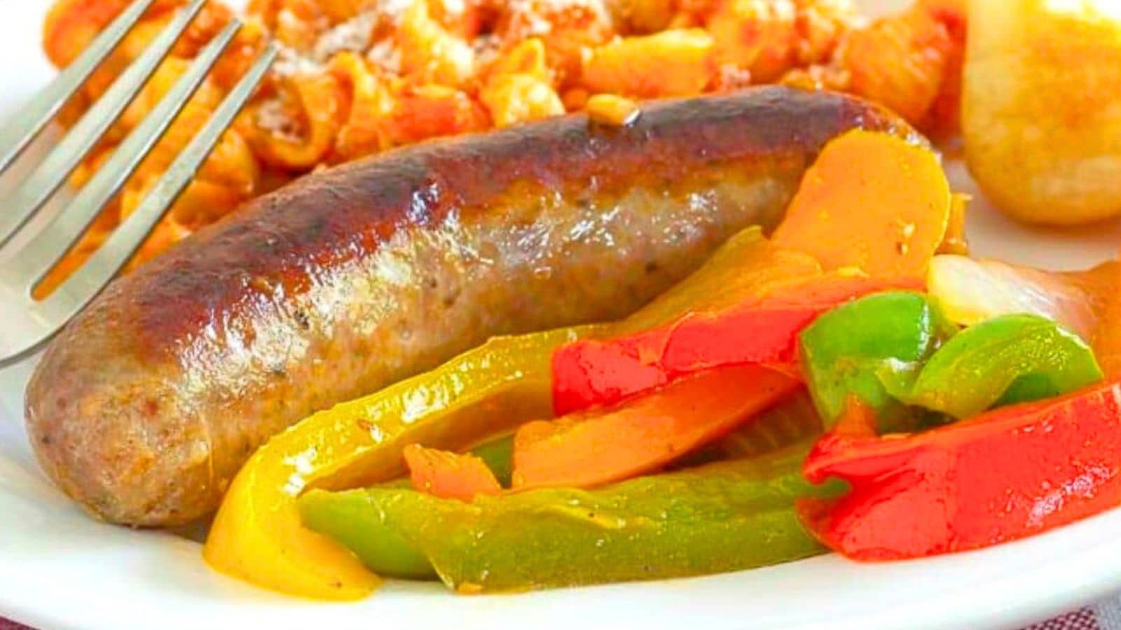 Sausage and peppers on a plate with pasta