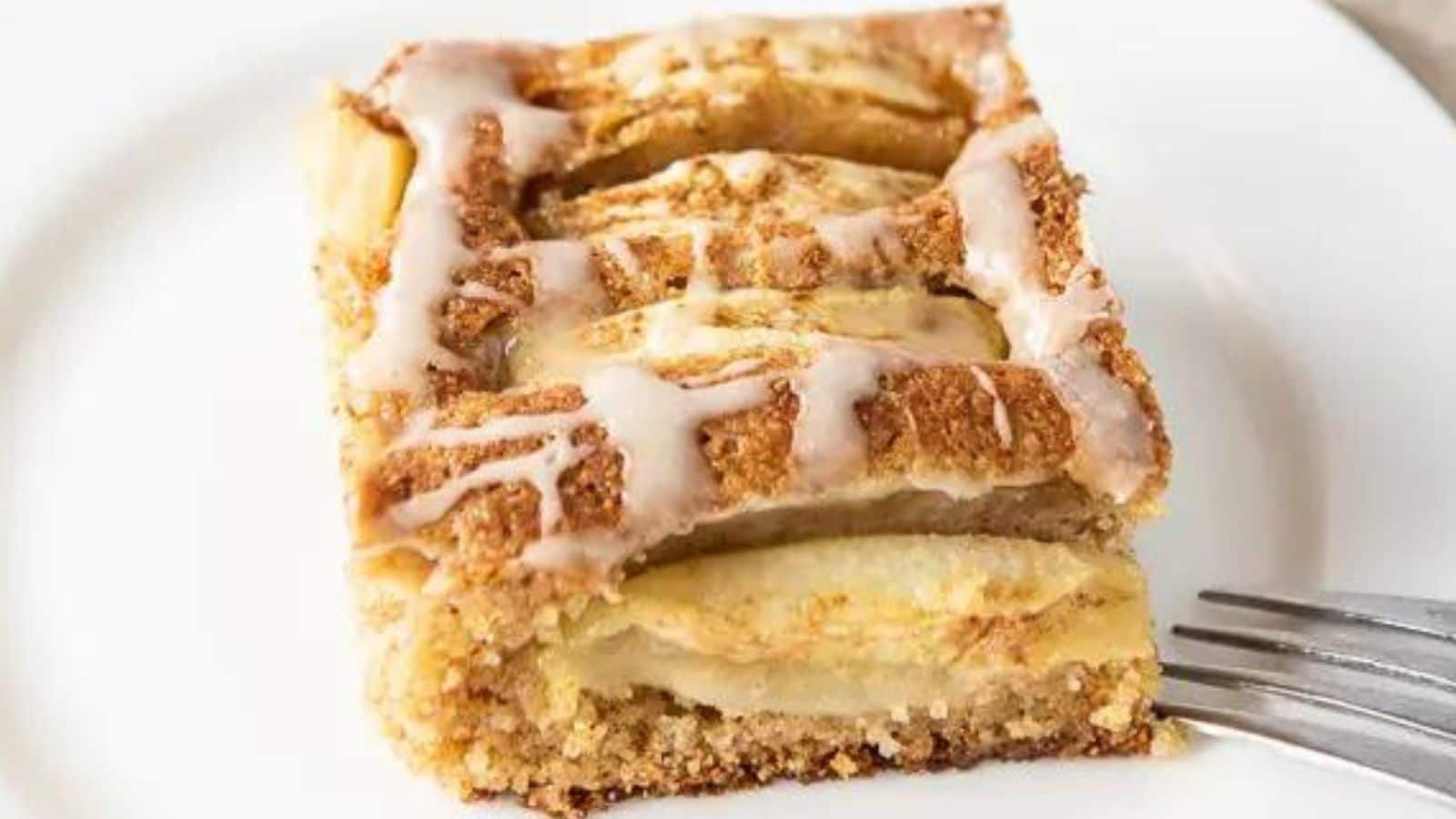 Slice of apple cider cake on a plate