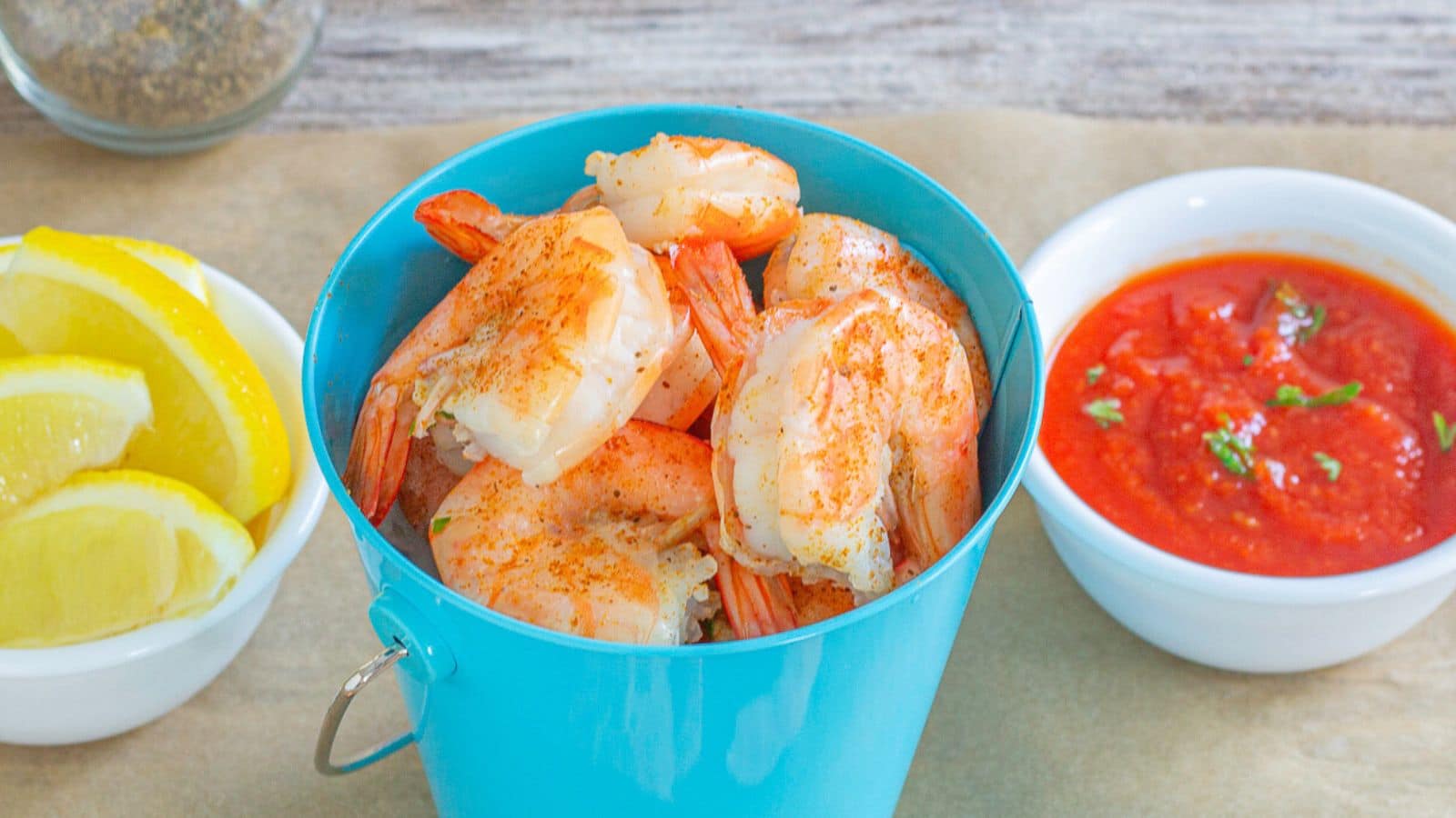 Beer boiled shrimp in a blue bucket