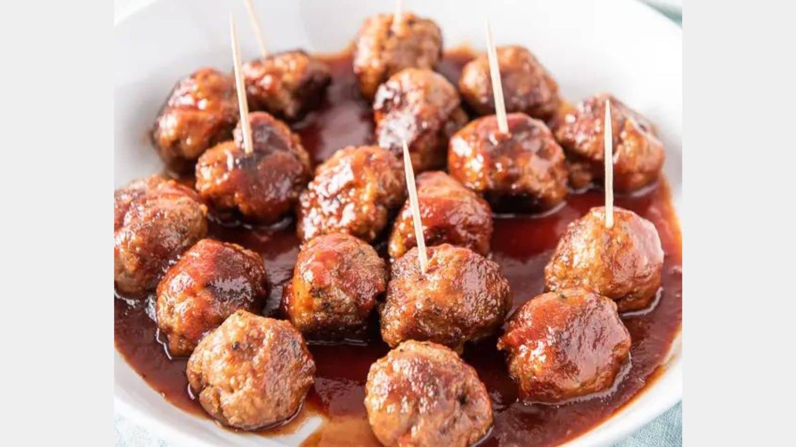 Bourbon Meatballs on a plate with sauce