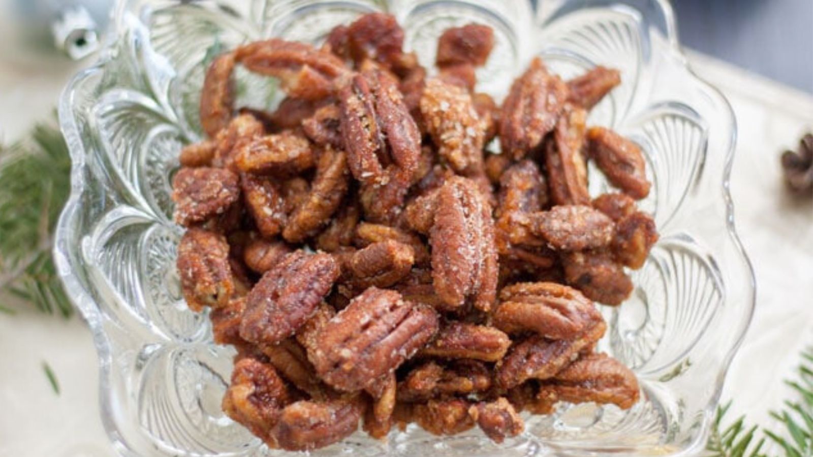 Spicy pecans in a glass dish
