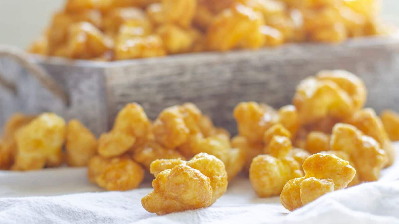 caramel coated corn puffs on a table