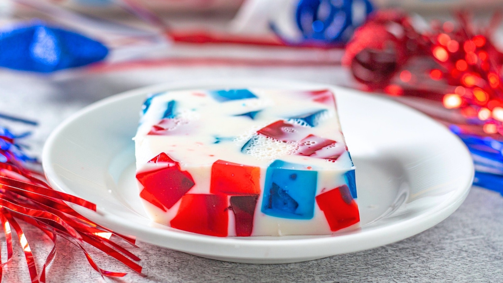 red white and blue jello dessert slice on a plate