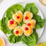 Southern pear salad topped with maraschino cherries