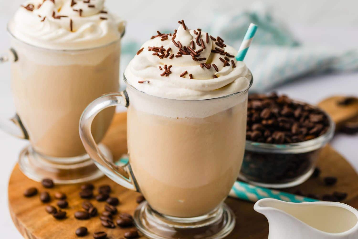 Iced coffee topped with whipped cream and chocolate shavings