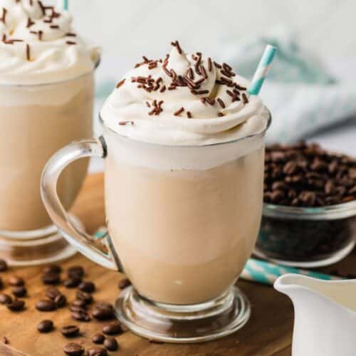 Iced coffee topped with whipped cream and chocolate shavings