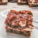 close up view of a slice of mississippi mud cake showing the layers from the side